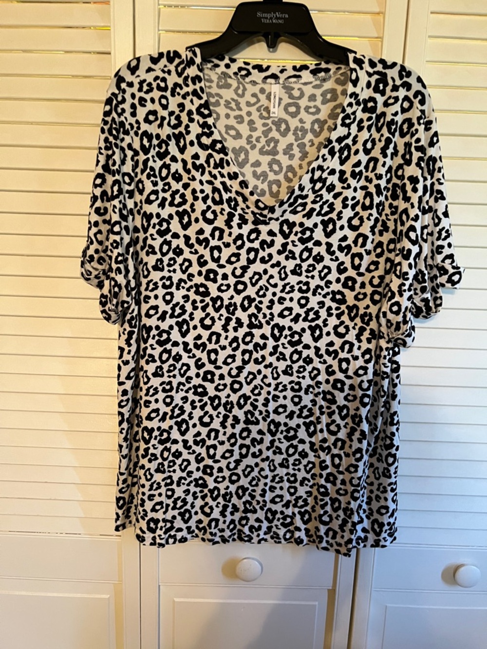 Cheetah print V-neck women’s tee. Great for LAYERING YEAR ROUND & Spring/Summer!